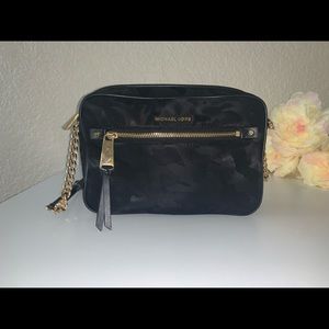 Black crossbody Michael Kors purse - camo print